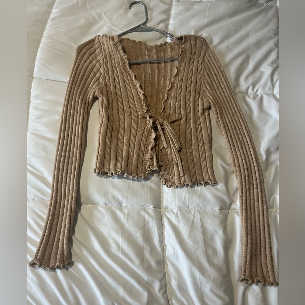 Tan knit sweater with tie in front. Size Small
